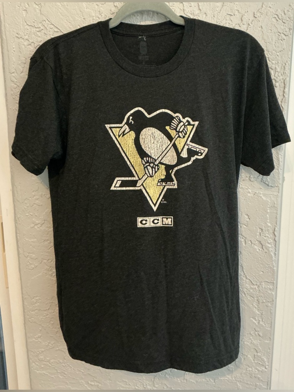 CCM Black Pittsburgh Penguins Logo T‑Shirt with Yellow and White Accents